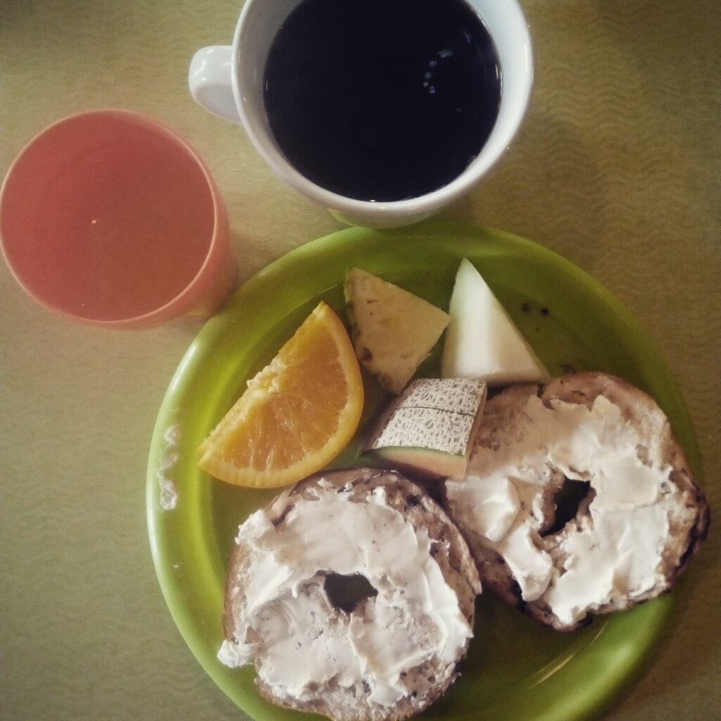 Green Tortoise Breakfast - bagels, fruit, coffee and juice.