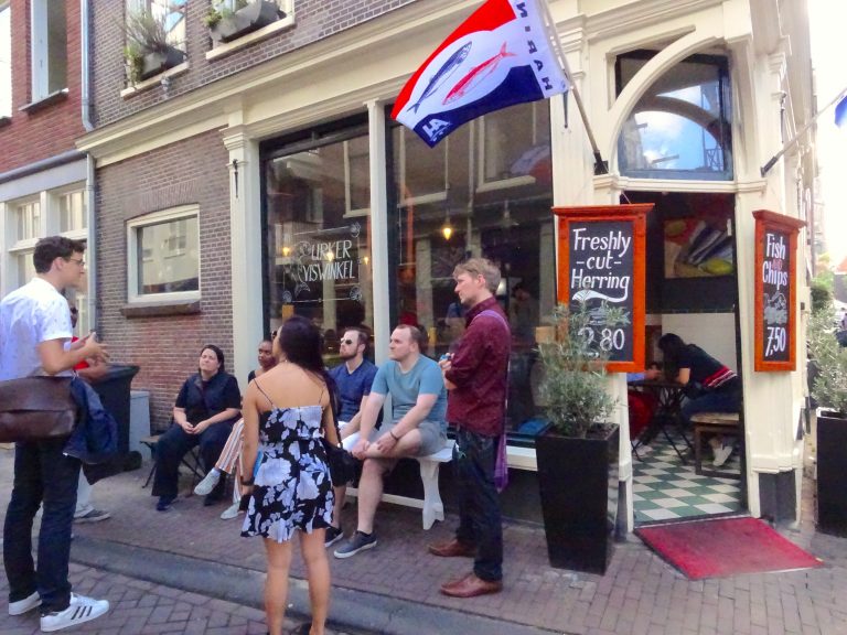 Jelte Explaining About Herringm Outside Urker Viswinkel