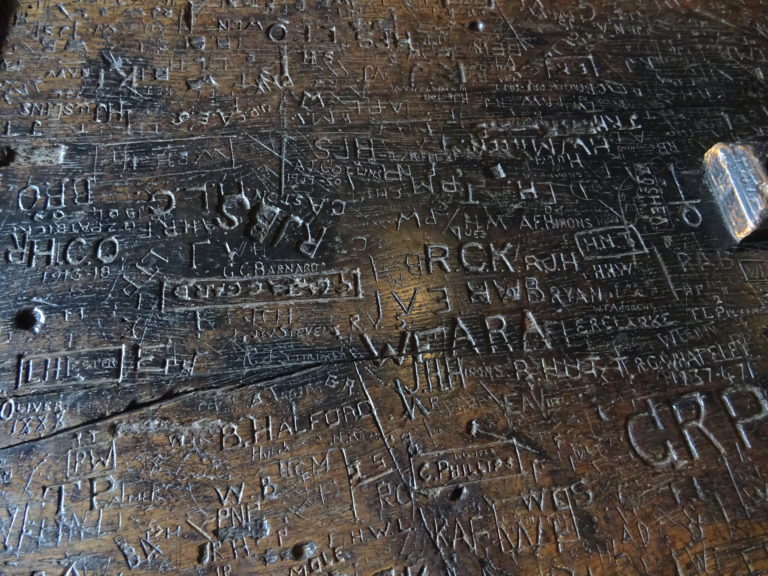 The Table Was Covered In Carvings