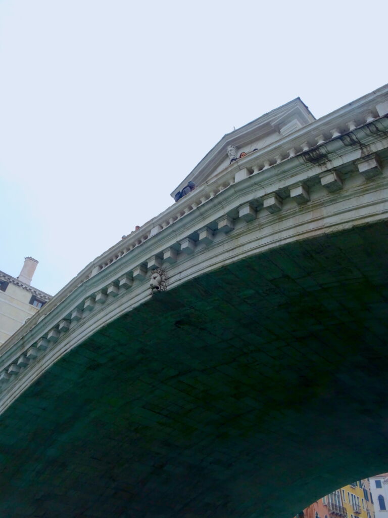View Of Rialto Bridge While Passing Under It